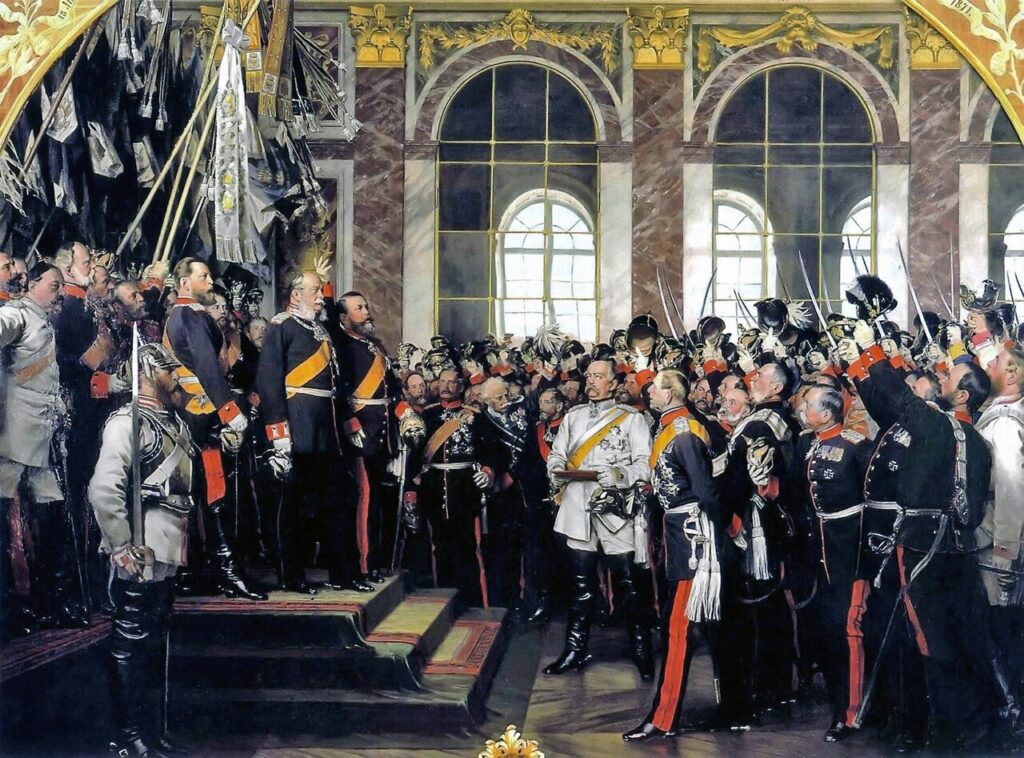 Proclamació de l'Imperi alemany al Saló dels Miralls de Versalles (18 gener 1871). Bismarck (de blanc) ha unificat Alemanya per dalt.